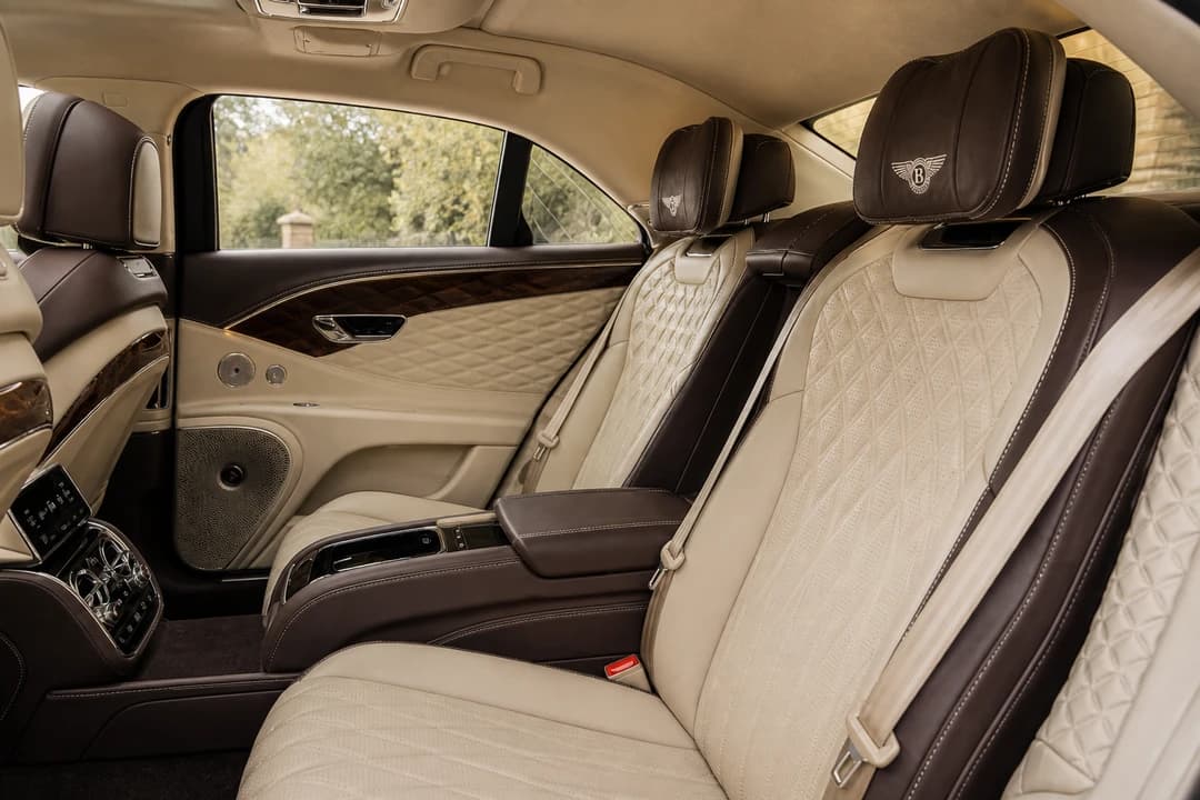 Bentley Flying Spur hire Dubai rear cabin with diamond-quilted leather for executive rear-seat stays