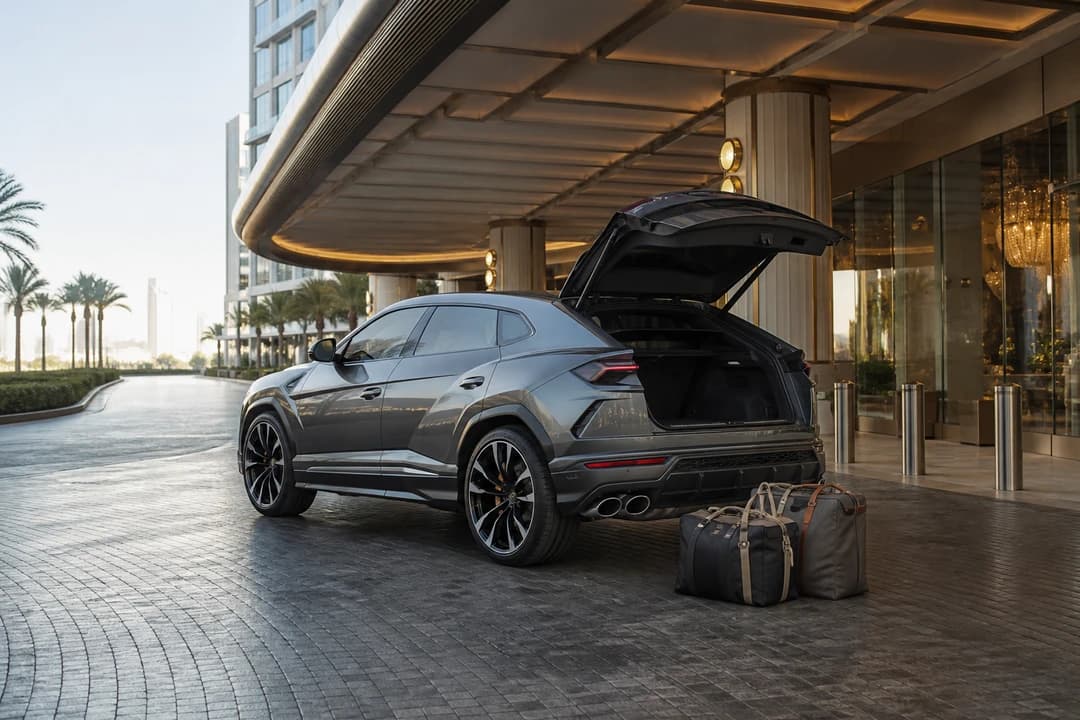 Luxury SUV Bluewaters hotel handover with a Lamborghini Urus and soft bags at Caesars Palace Dubai