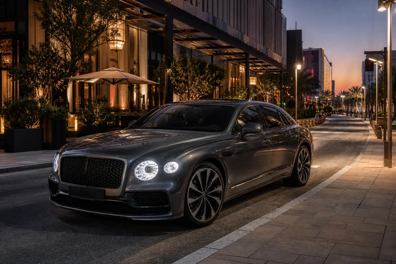 Luxury car rental City Walk Dubai hero with a Bentley Flying Spur on the evening boulevard