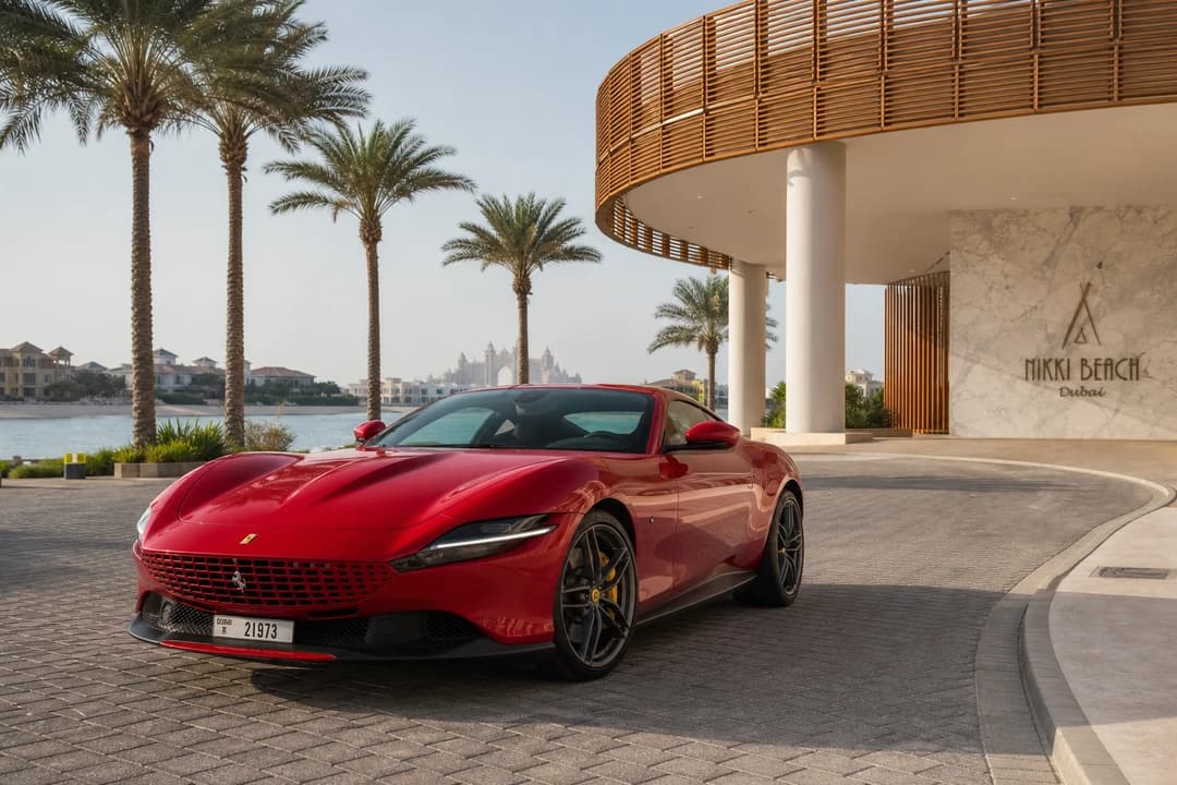 Ferrari Roma at Palm Jumeirah beach club arrival for luxury SUV Palm Jumeirah weekend plans