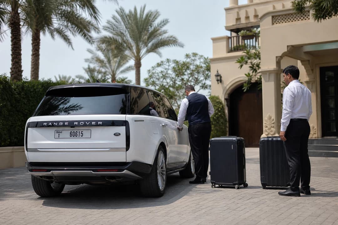 Range Rover at Palm Jumeirah villa driveway with luggage for Palm villa car delivery