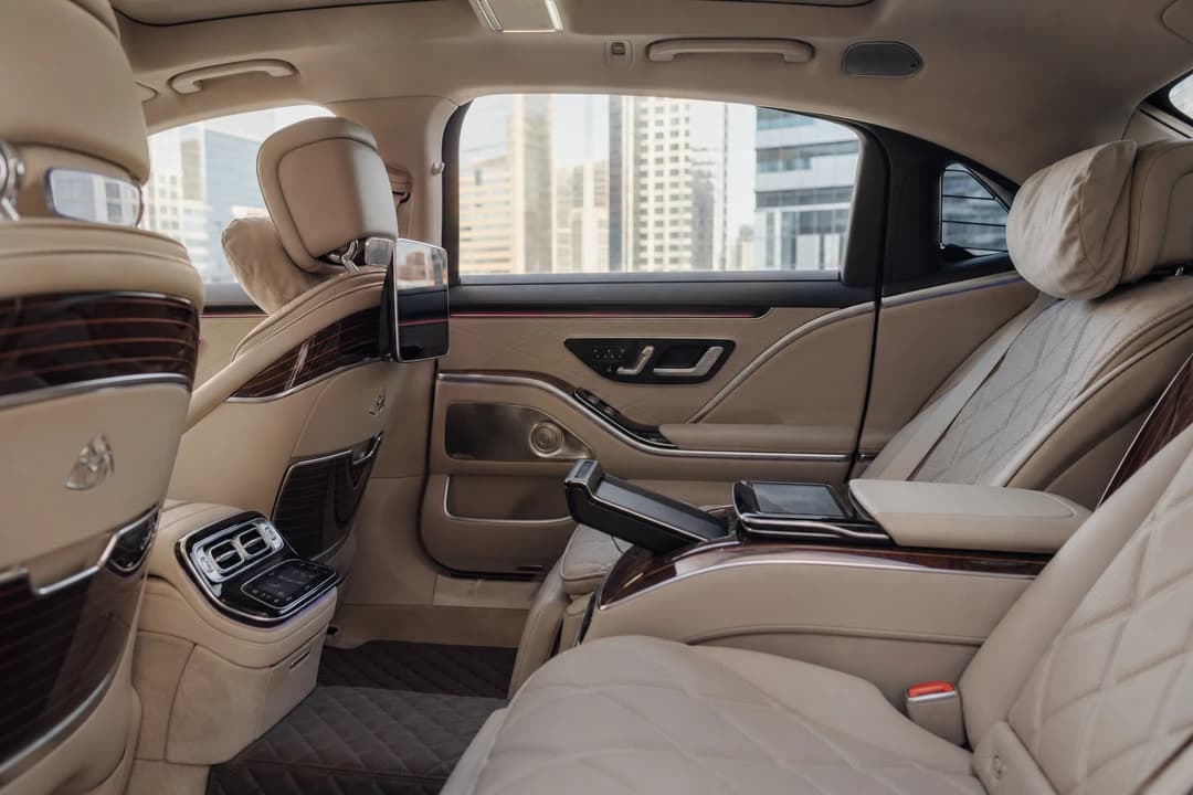 Maybach rear cabin leather seats for executive sedan rental Dubai meeting days