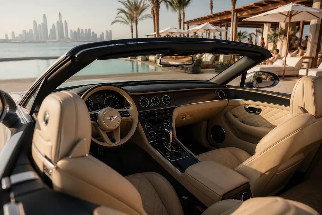 Open-top Bentley cabin overlooking a Dubai beach club pool for best cars to rent Dubai brunch days