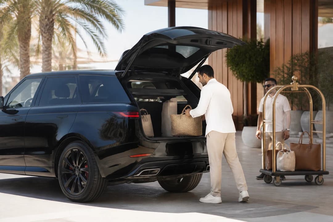 Range Rover Sport beach club valet with soft bags for Dubai car hire weekend brunch groups