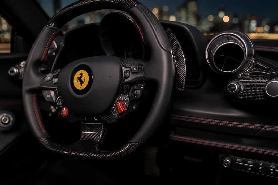 Ferrari F8 Tributo Spider steering detail for Dubai proposal photoshoot car rental supercar evenings