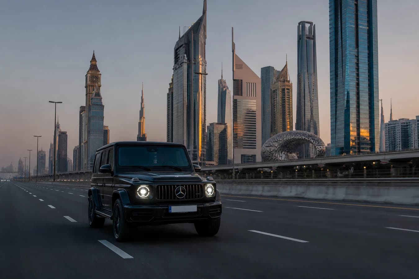 Dubai summer early morning driving rental: a closed luxury SUV on Sheikh Zayed Road at soft dawn before peak heat