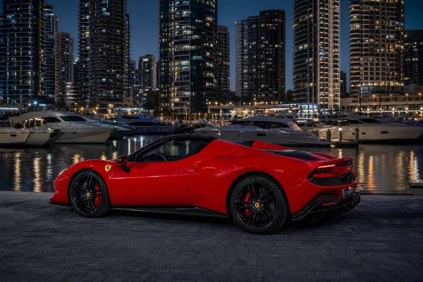 Ferrari 296 GTS rental Dubai guide hero with open-top hybrid Ferrari at Dubai Marina yacht quay at night