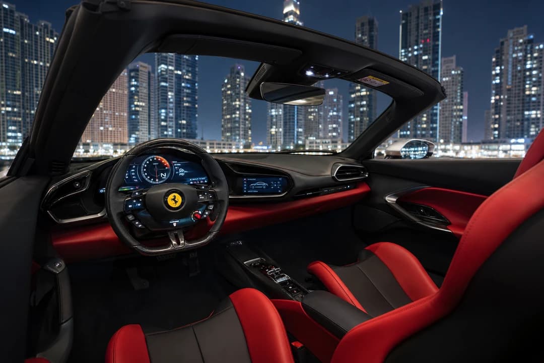 Ferrari 296 GTS open-cockpit interior with carbon wheel and night Marina lights for Dubai convertible drives