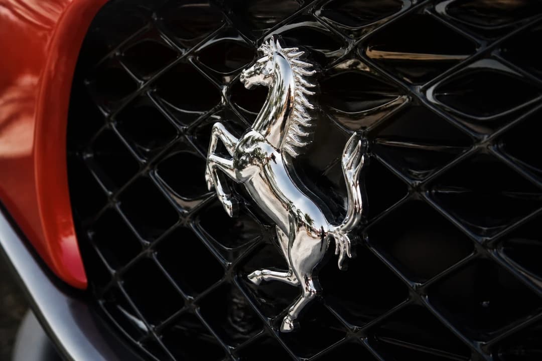 Ferrari Purosangue Prancing Horse badge detail for Ferrari identity on a luxury SUV body