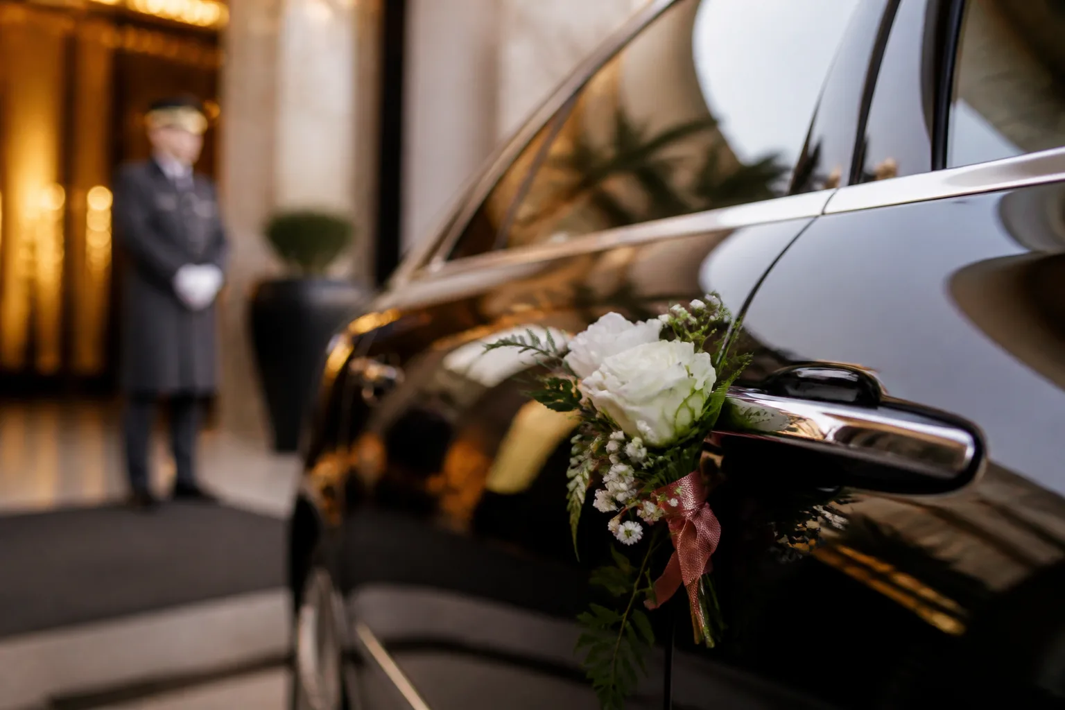 Luxury car door handle detail at a Dubai hotel entrance for wedding weekend arrivals