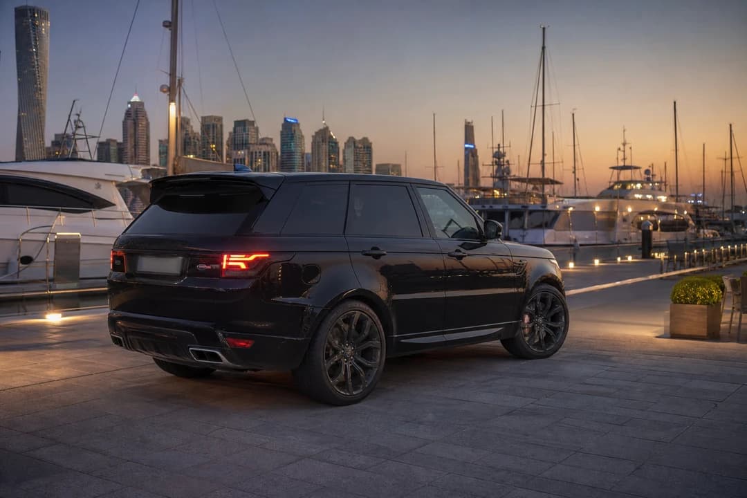 Black Range Rover Sport at Dubai Harbour in the evening for exotic car rental Dubai SUV arrivals