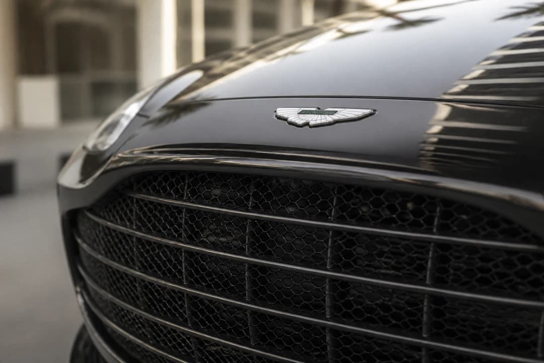 Aston Martin DBX mesh grille and wings badge detail for Aston Martin DBX rental Dubai identity