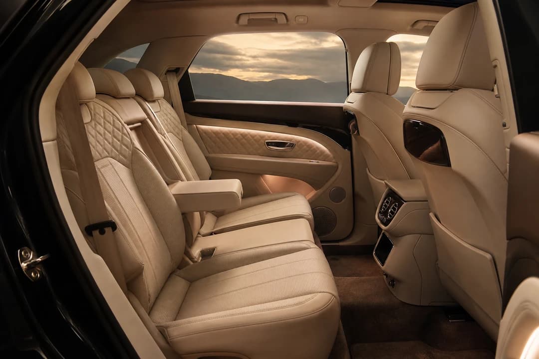 Bentley Bentayga interior rear cabin with quilted leather for family luxury SUV rental Dubai