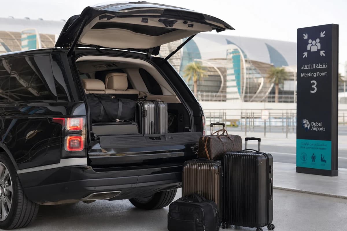 Airport SUV rental Dubai with luggage load at DXB meeting point for family arrival plans