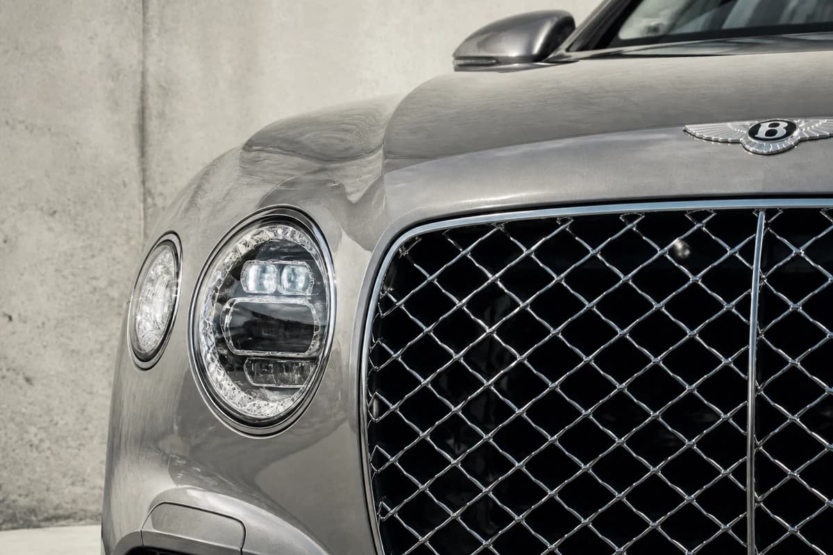 Bentley Flying Spur grille against d3 concrete for luxury car rental Dubai Design District