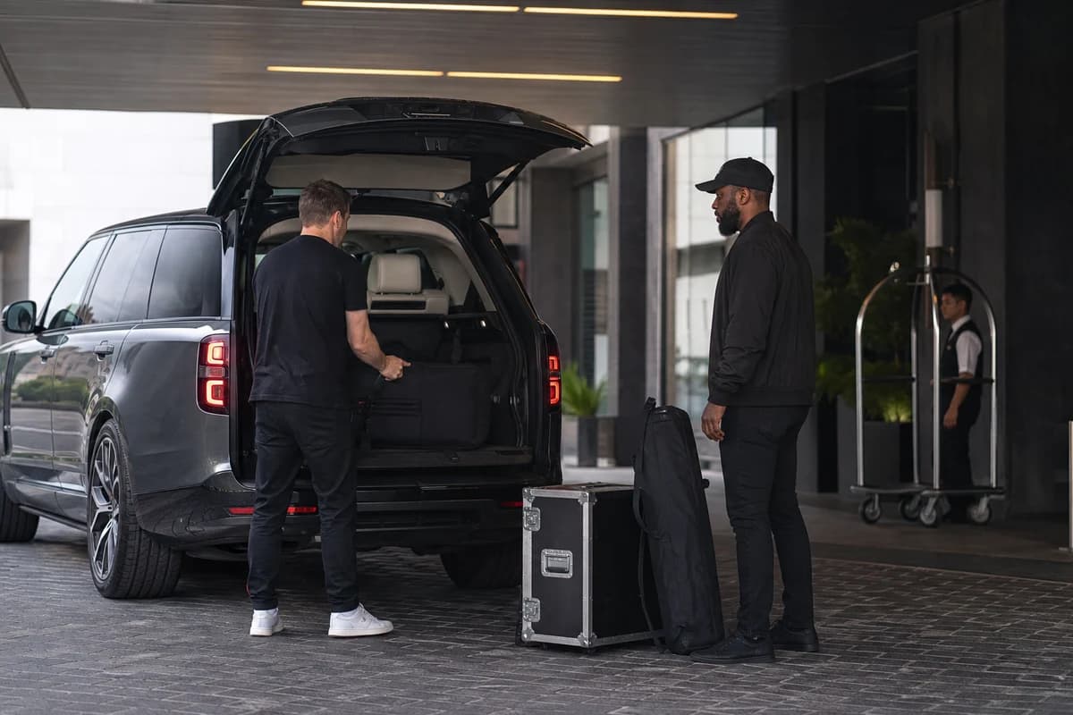 Luxury SUV Dubai car delivery at a d3 loading bay with soft equipment cases