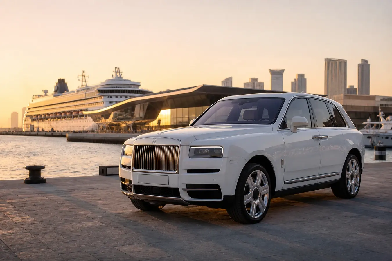 Car rental Dubai Harbour luxury hero with a white Rolls-Royce Cullinan at the cruise terminal waterfront at golden hour