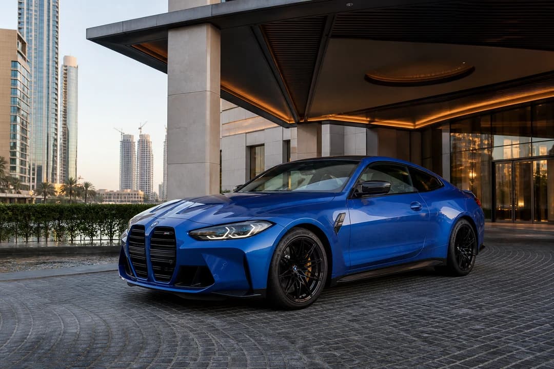 BMW sports coupe at a Downtown Dubai hotel for luxury car rental Dubai winter hotel weeks