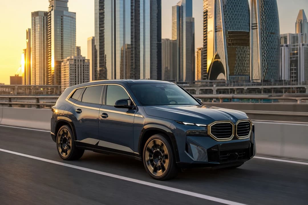 Rent BMW XM Dubai: XM SUV on Sheikh Zayed Road at golden hour for luxury car rental Dubai city weeks