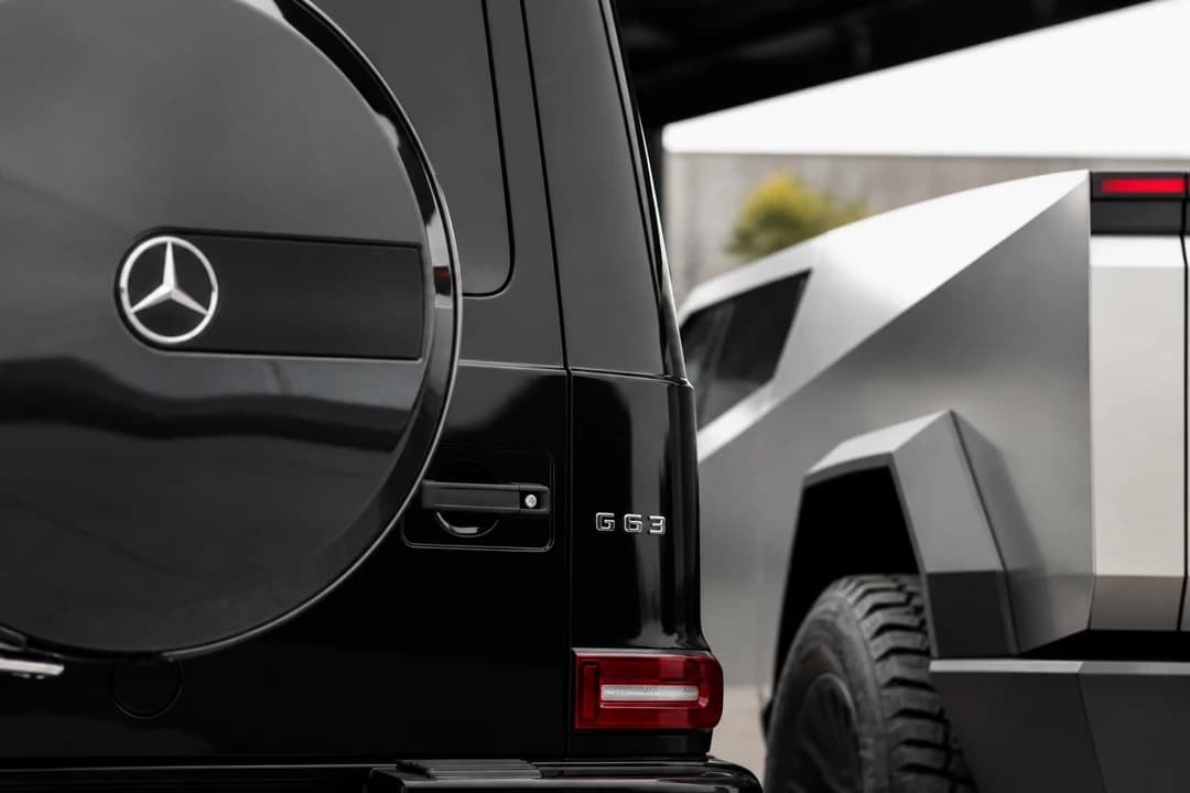 Mercedes-Benz G63 spare-wheel cover beside Tesla Cybertruck body edge for Cybertruck vs G63 rental Dubai identity