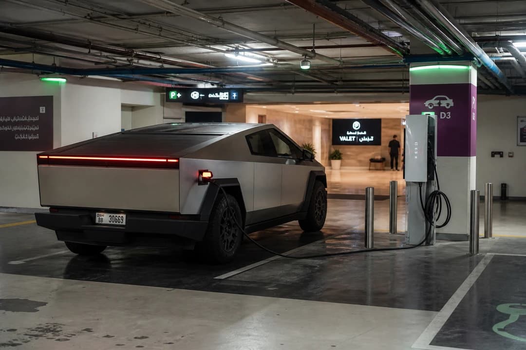 Tesla Cybertruck at a Dubai mall basement charger for Cybertruck vs G63 rental Dubai charging reality