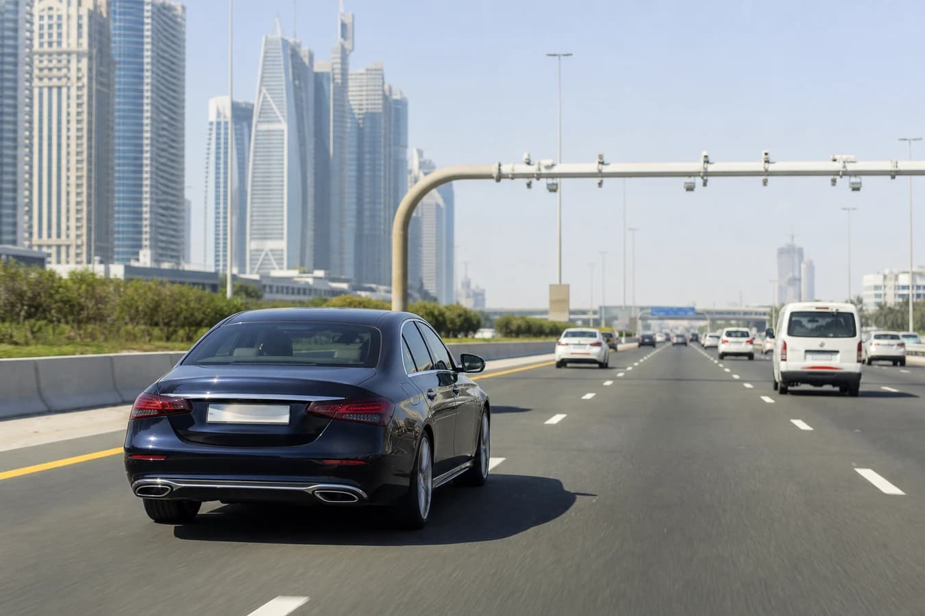 Dubai black points tourists rental car: luxury hire on Sheikh Zayed Road with clear speed and lane discipline in daylight