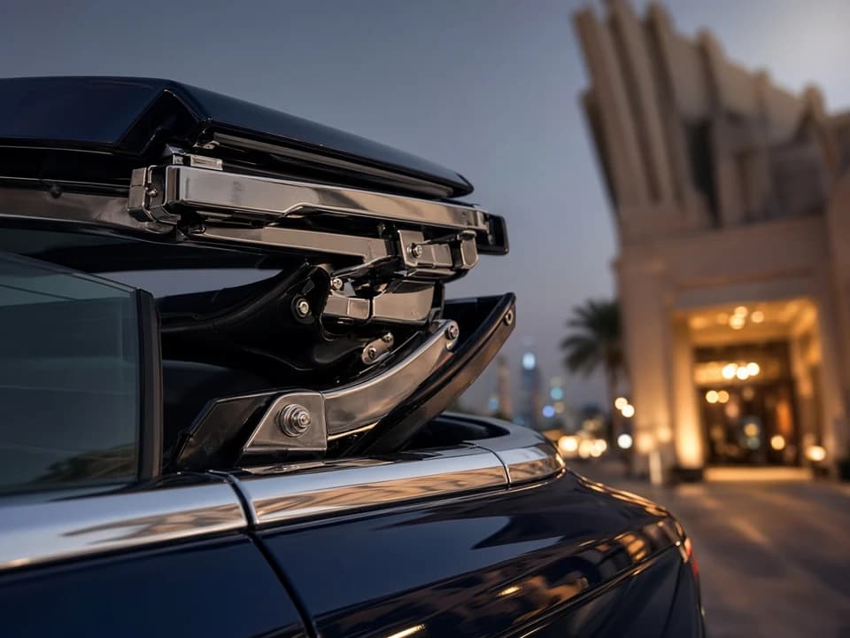 Convertible roof mechanism detail before a Dubai coastal drive luxury car evening on Beach Road