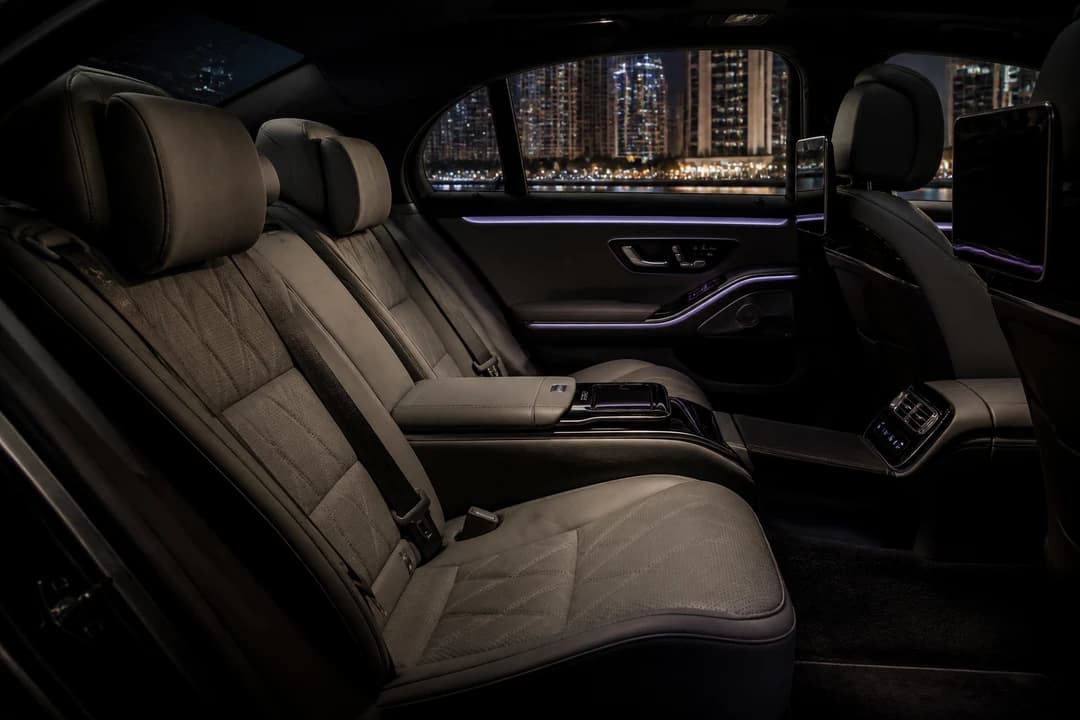 Calm ultra-luxury sedan rear cabin at night for best cars to rent Dubai Opera cultural evenings