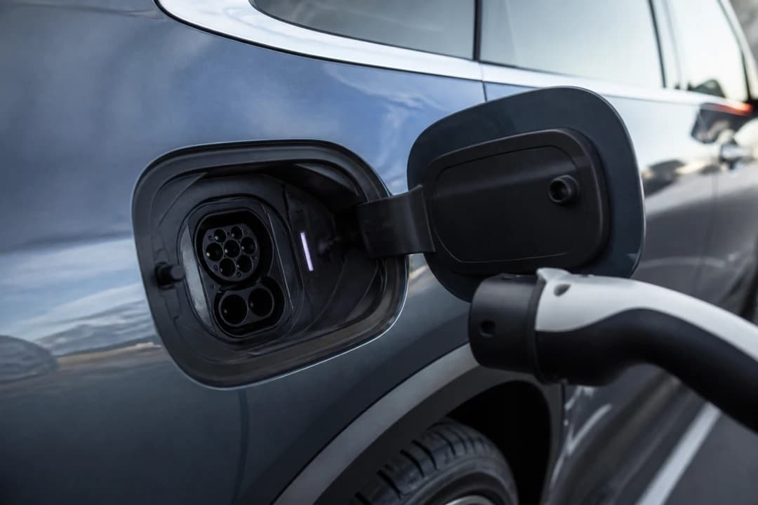 Electric charging port detail on a luxury EV for electric vs petrol luxury car rental Dubai identity