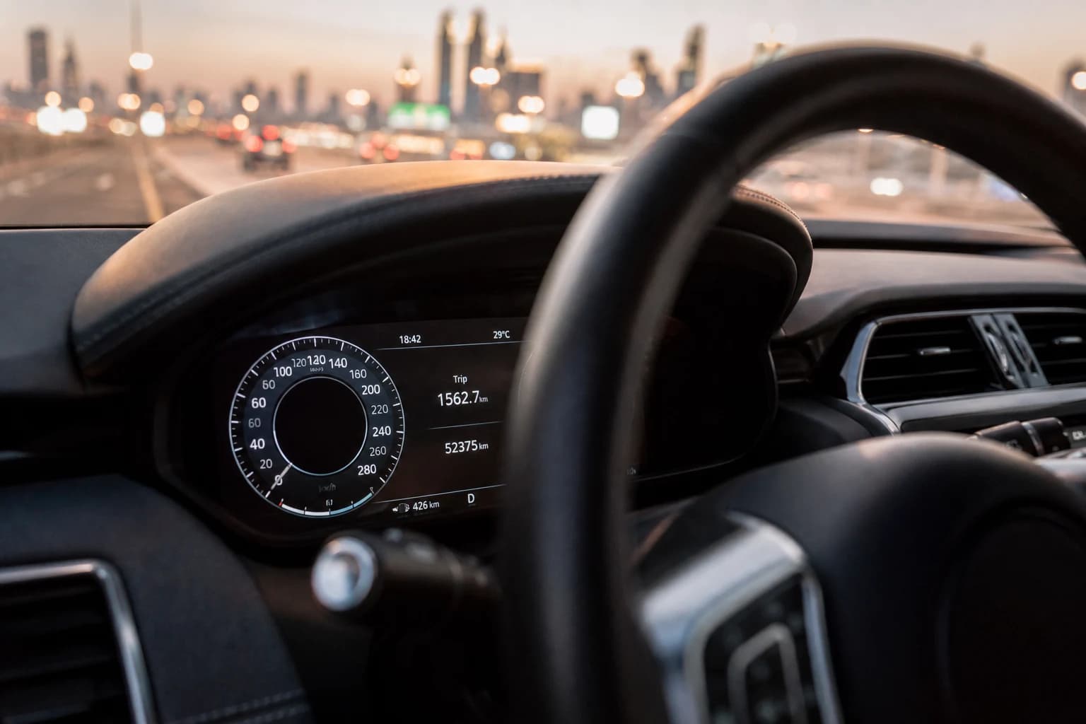 Extra mileage rental car Dubai: trip computer showing high kilometre count on a luxury SUV return