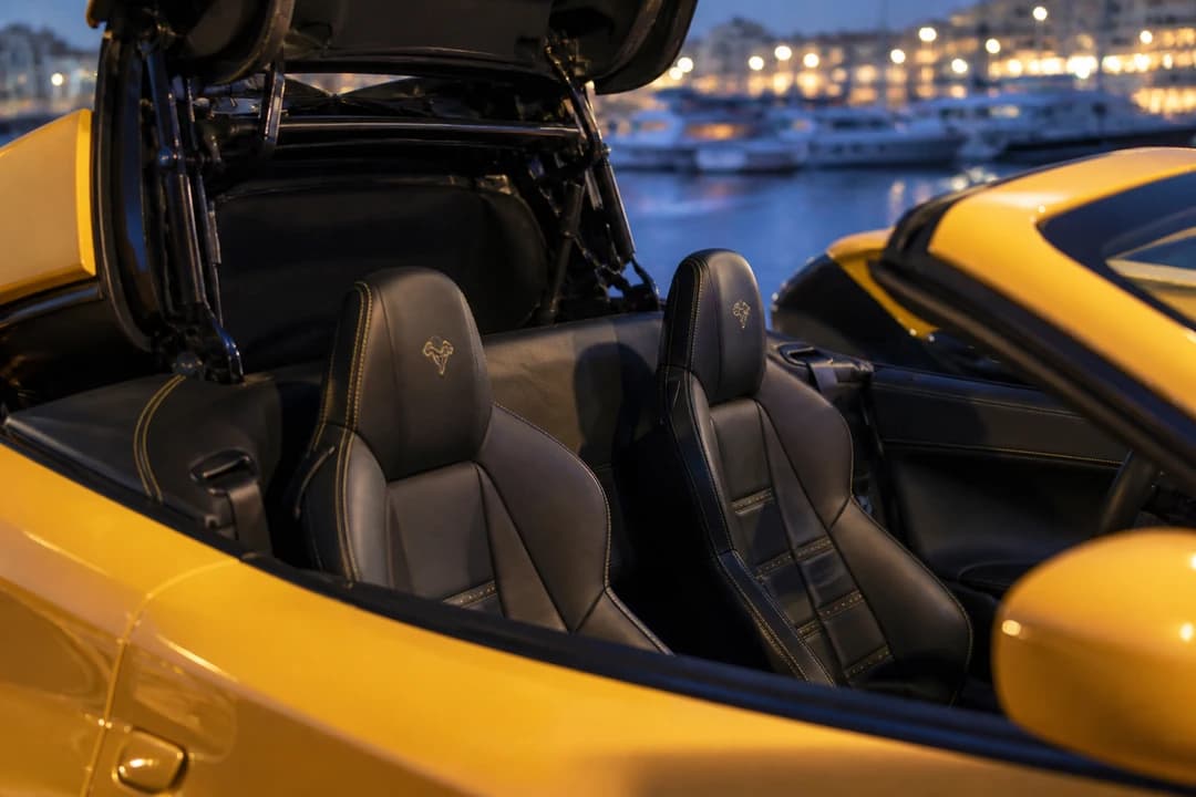 Ferrari spider cabin with retractable hardtop open for best luxury car Dubai open-air evenings
