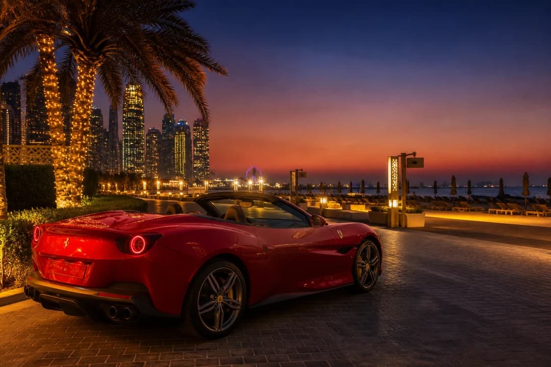 Ferrari Portofino convertible at JBR promenade after sunset for Ferrari Portofino hire Dubai evenings