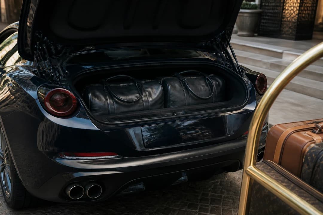Soft overnight bags in a Ferrari Portofino boot for rent Ferrari Portofino Dubai packing honesty