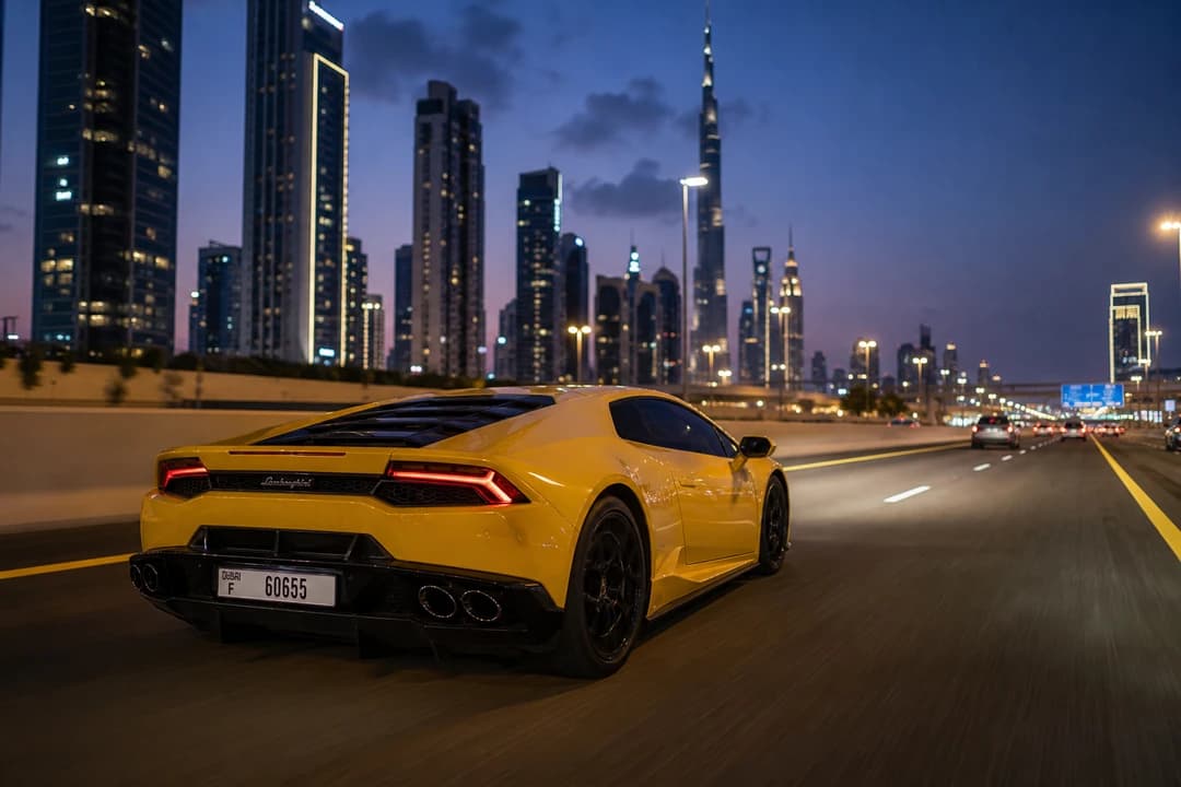 Petrol Lamborghini Huracan on Sheikh Zayed Road at blue hour for supercar rental Dubai heat and range freedom