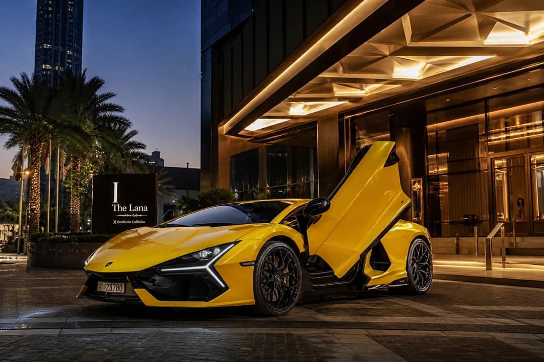 Lamborghini Revuelto at a Downtown Dubai hotel for luxury car comparison Dubai hybrid V12 arrival