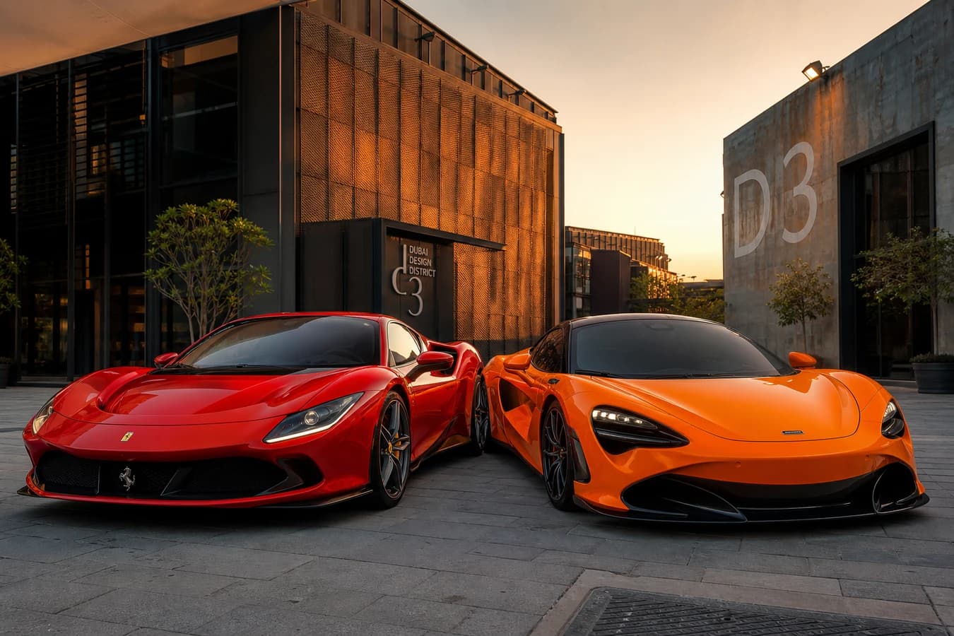 Hybrid vs petrol supercar rental Dubai hero with a Ferrari plug-in hybrid and McLaren coupe at Dubai Design District