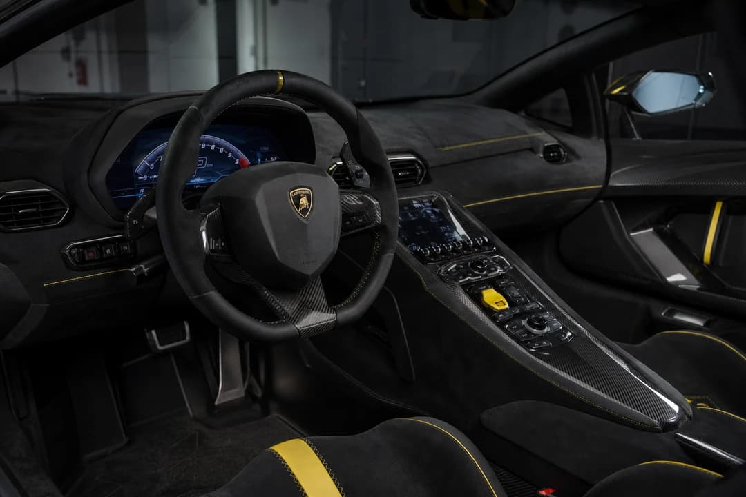 Lamborghini Aventador hire Dubai cockpit with hexagonal vents and carbon fibre for luxury car rental Dubai V12 cabin