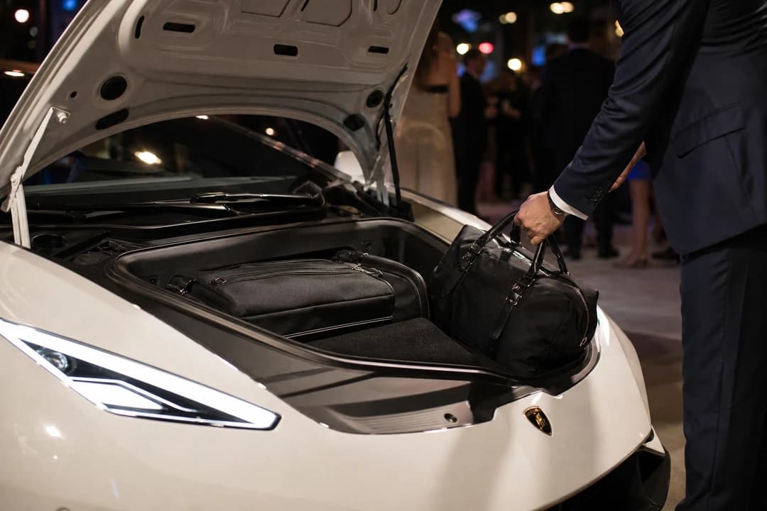 Lamborghini Huracan EVO Coupe front luggage space with evening wear bag for two-seat event trips