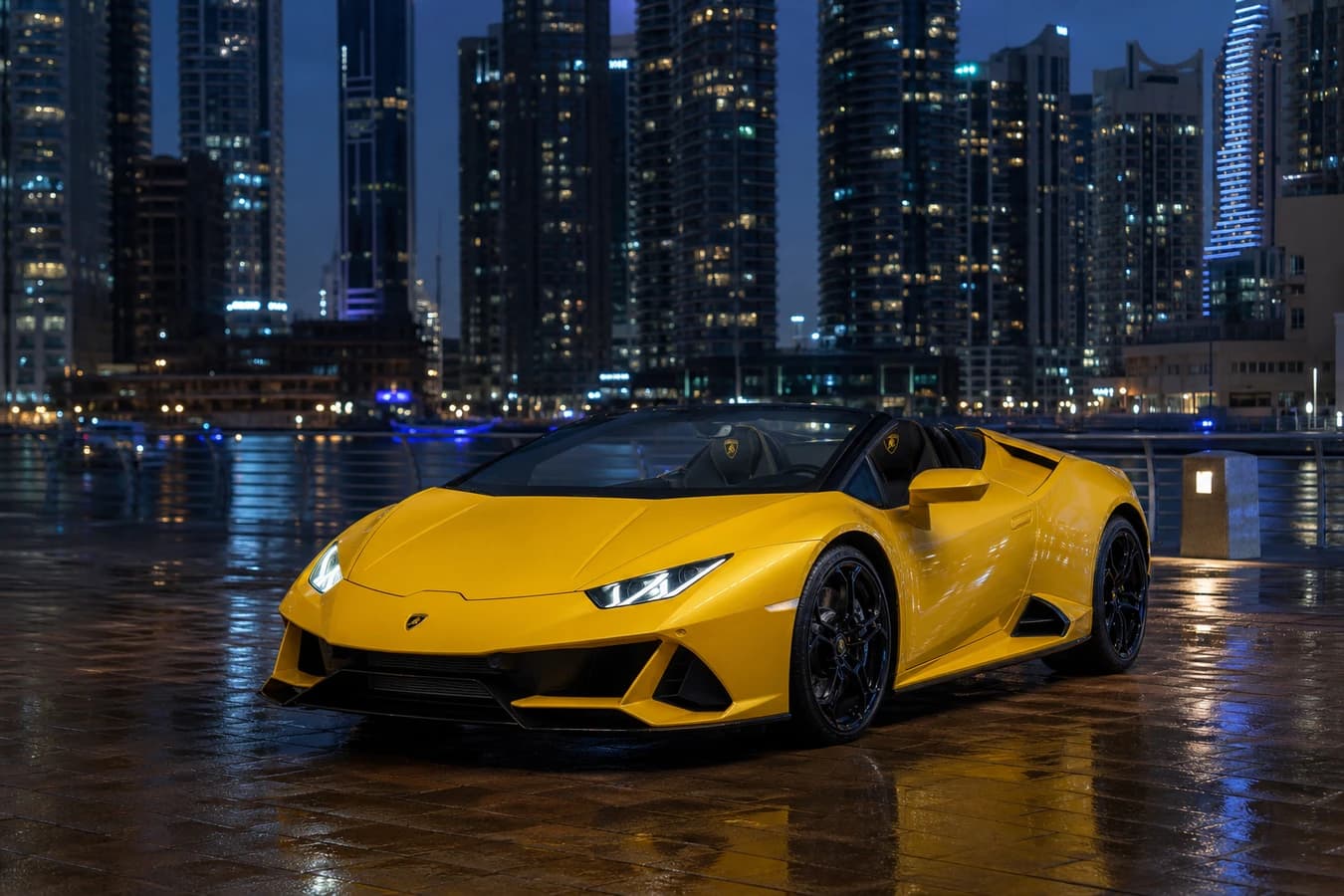 Lamborghini Huracan Spyder rental Dubai: yellow Huracán EVO Spyder roof-down at Dubai Marina blue hour