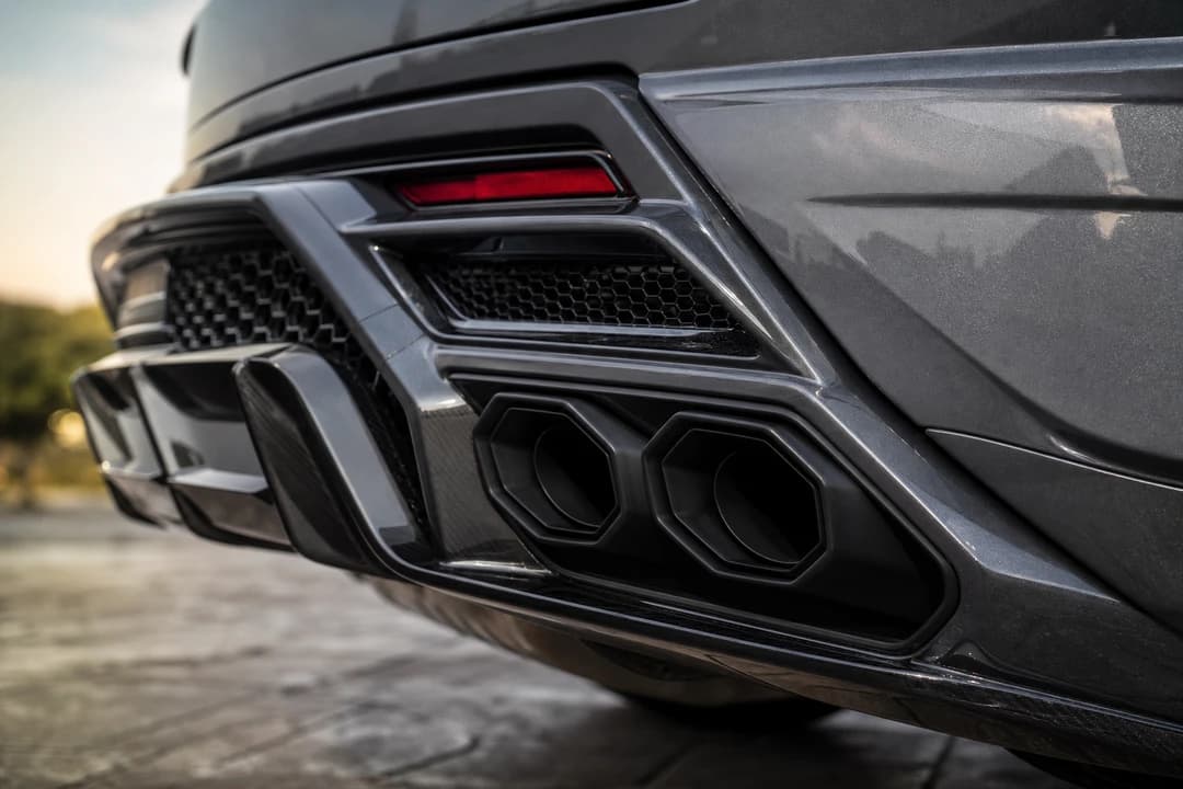 Lamborghini Urus SE model detail with aggressive rear design and hybrid V8 presence