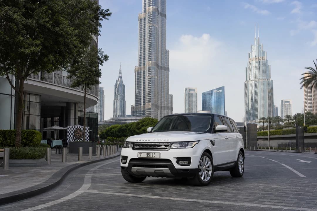 Range Rover at Downtown Dubai for best luxury SUV rental Dubai hotel and city plans