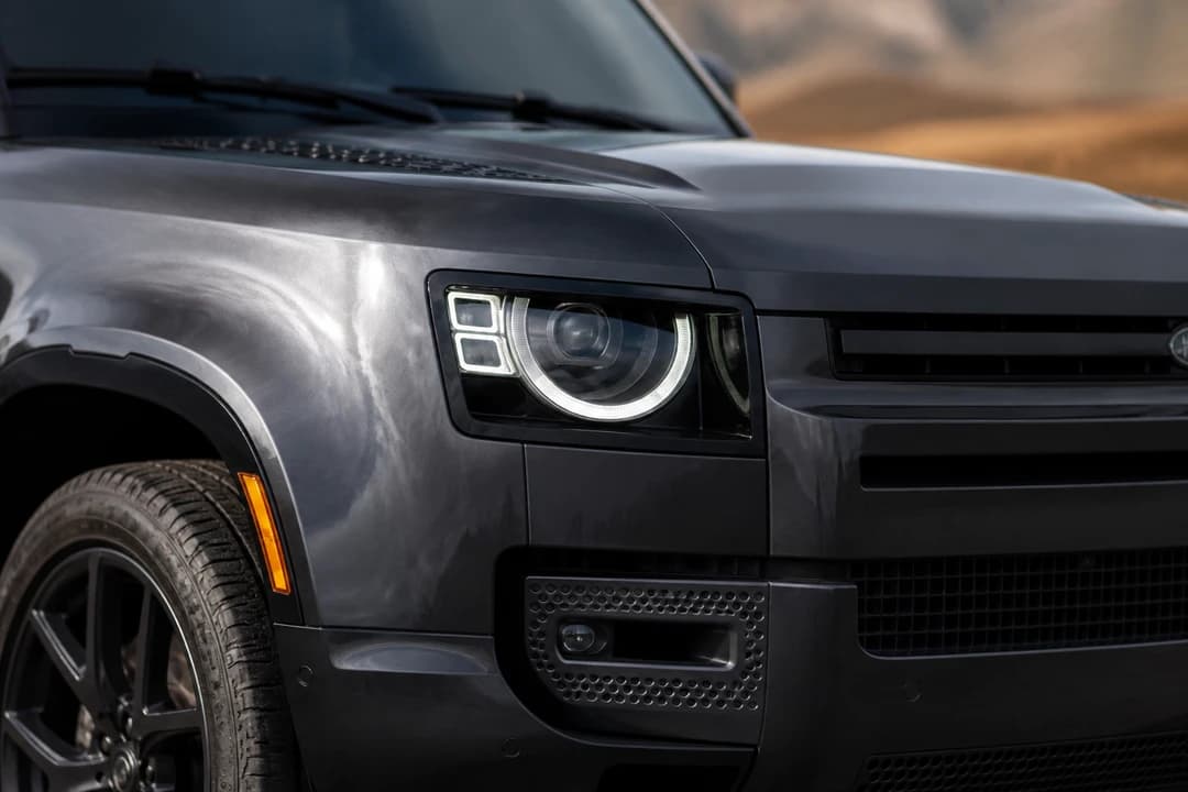 Land Rover Defender alpine lights and clamshell bonnet detail for Land Rover Defender rental Dubai identity