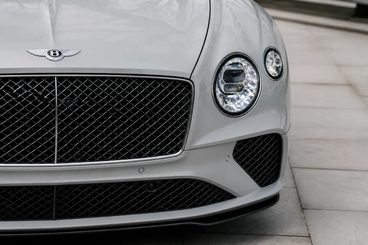 Bentley Continental GT Speed grille detail in cool winter daylight for luxury car rental Dubai