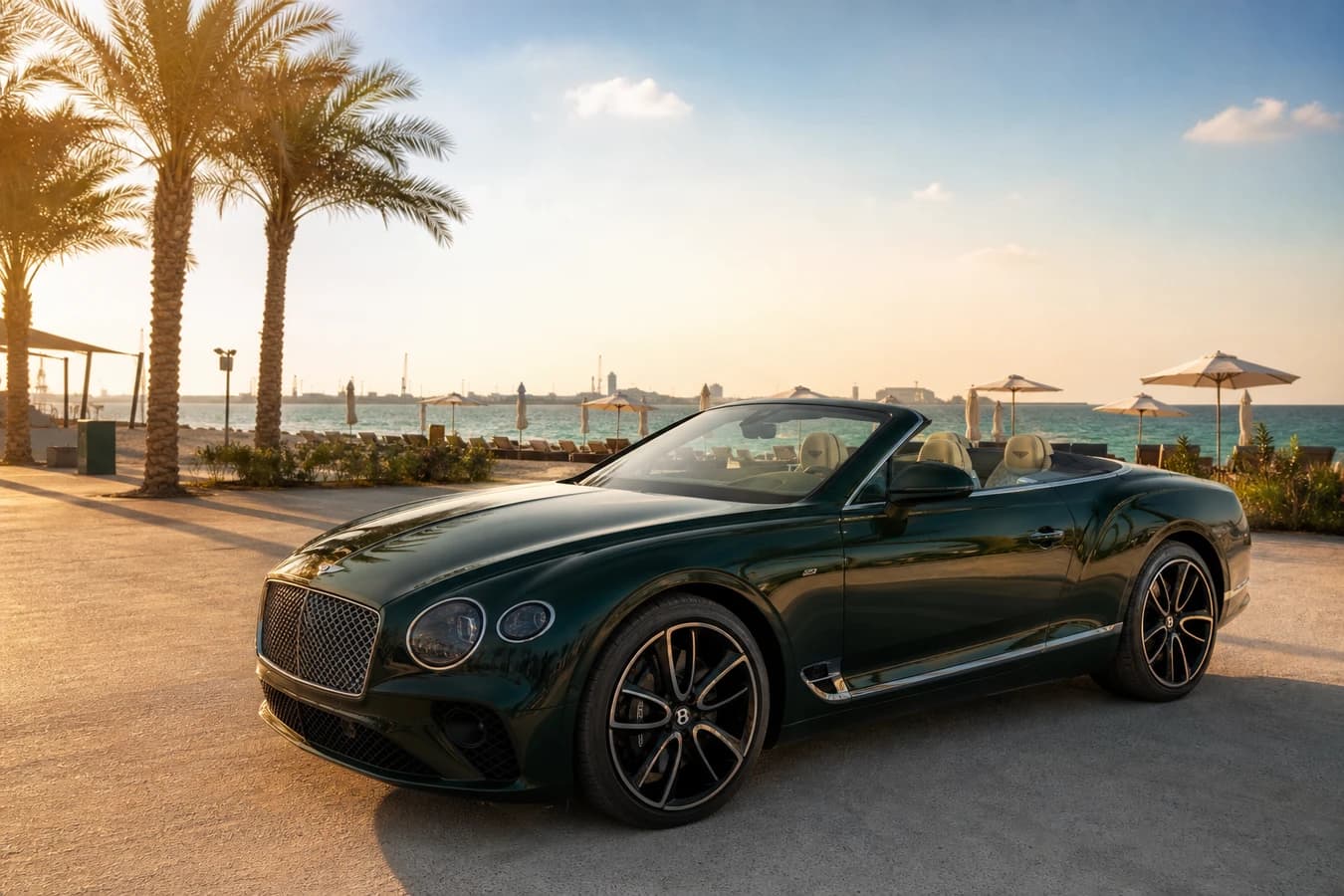 Luxury car rental La Mer Dubai hero with a Bentley Continental GTC at the beachfront promenade at golden hour