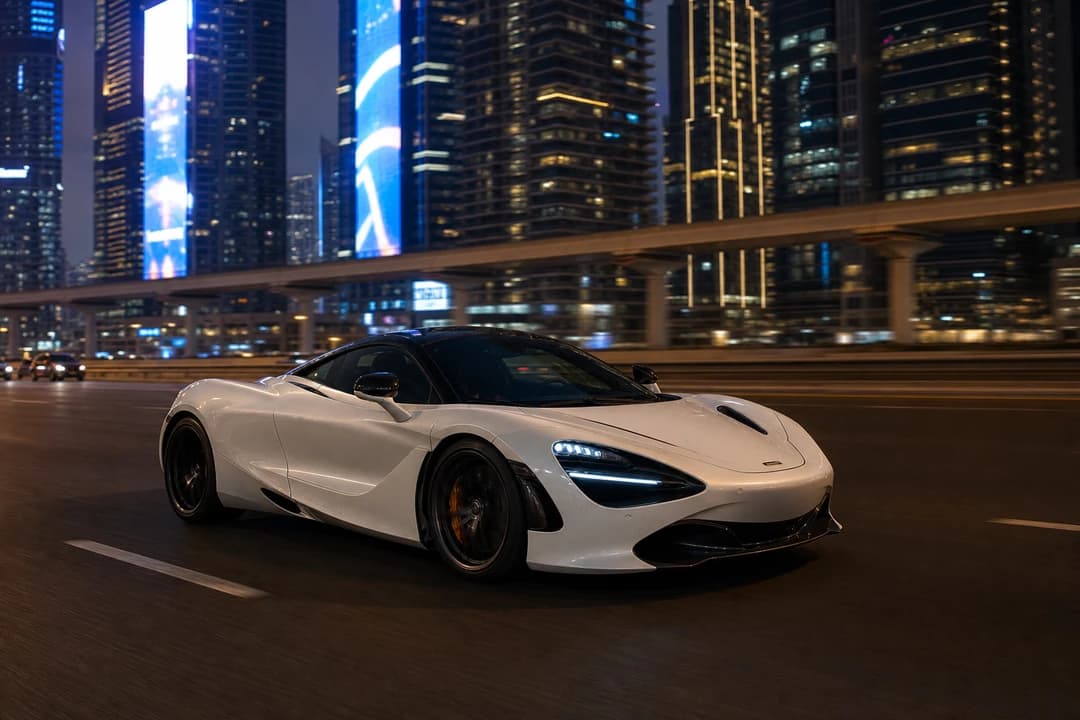 McLaren 720S Coupe on Sheikh Zayed Road at blue hour for exotic car rental Dubai first evening