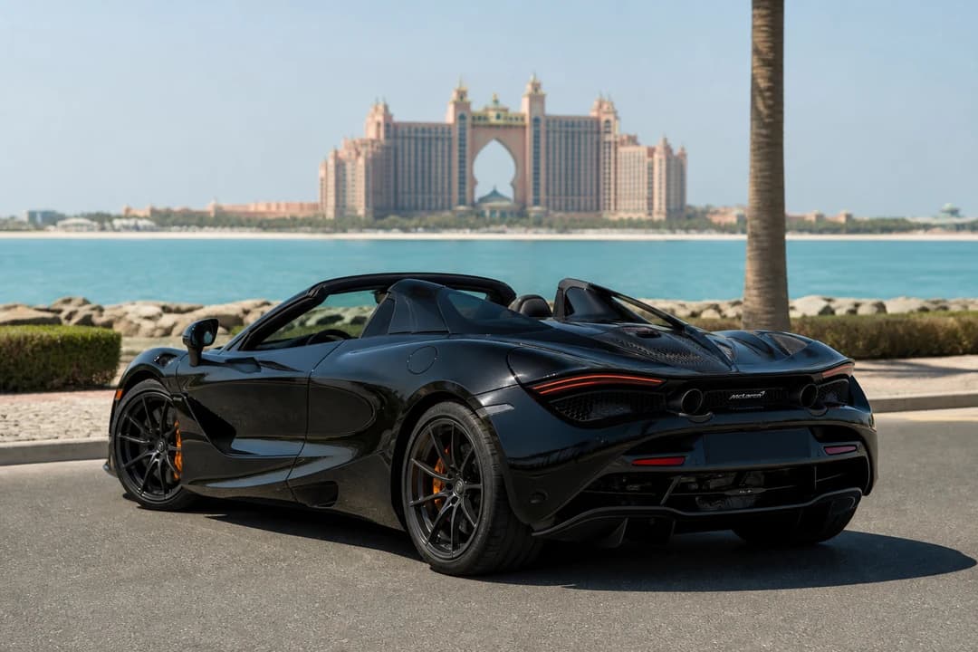 McLaren 720S Spider exterior on Palm Jumeirah Crescent at midday for rent McLaren 720S Spider Dubai coastal weekends