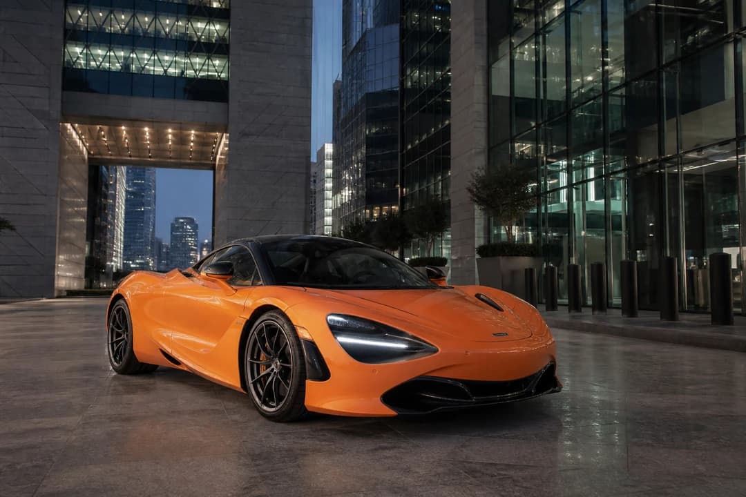 McLaren 720S Coupe at DIFC Gate in evening light for luxury car comparison Dubai Super Series weeks
