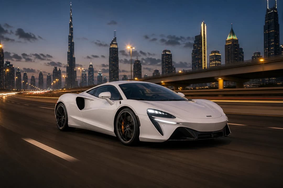 McLaren Artura Coupe on Sheikh Zayed Road at dusk for exotic car rental Dubai highway evenings