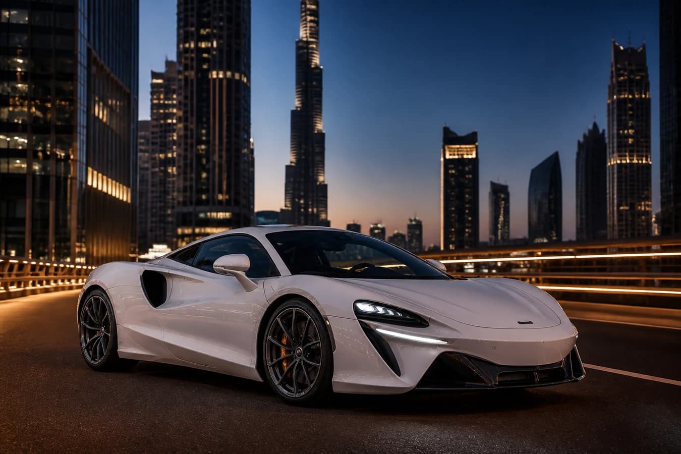 McLaren Artura rental Dubai hero with a silica white Artura Coupe on a Downtown connector at blue hour