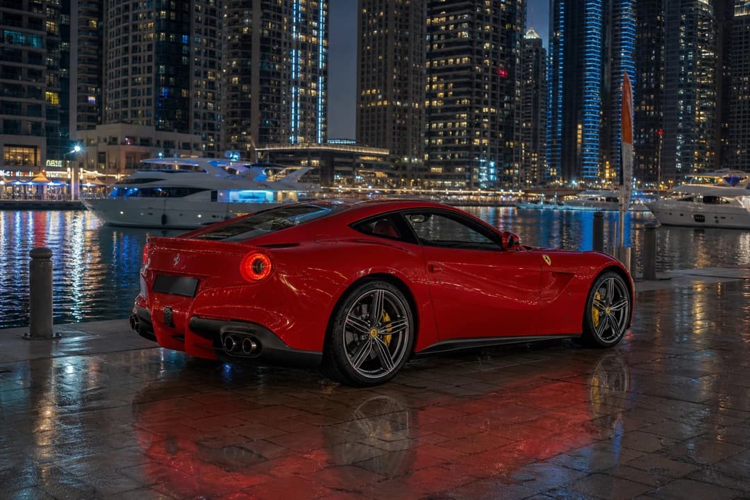 Ferrari at Dubai Marina Walk at dusk for luxury car comparison Dubai attention and evening plans